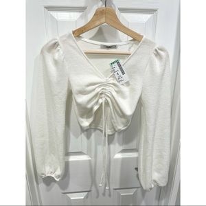 Cropped white long sleeve sweater